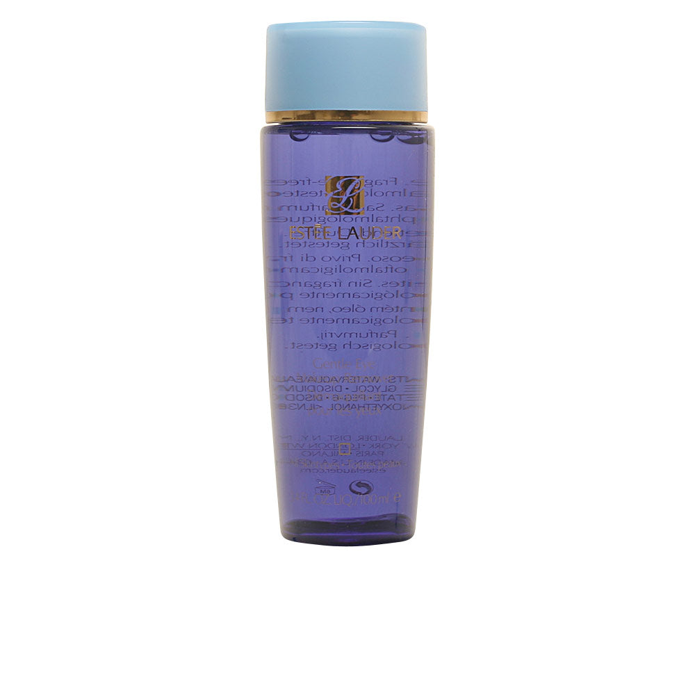 Estée Lauder Transparent cylindrical plastic bottle with purple, light-blue and gold accents, screw-cap closure, Est
