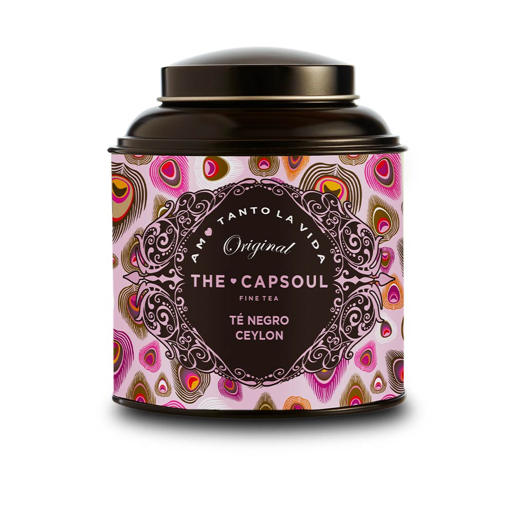 Loose Ceylon black tea leaves in a small scoop, 100 g pouch
