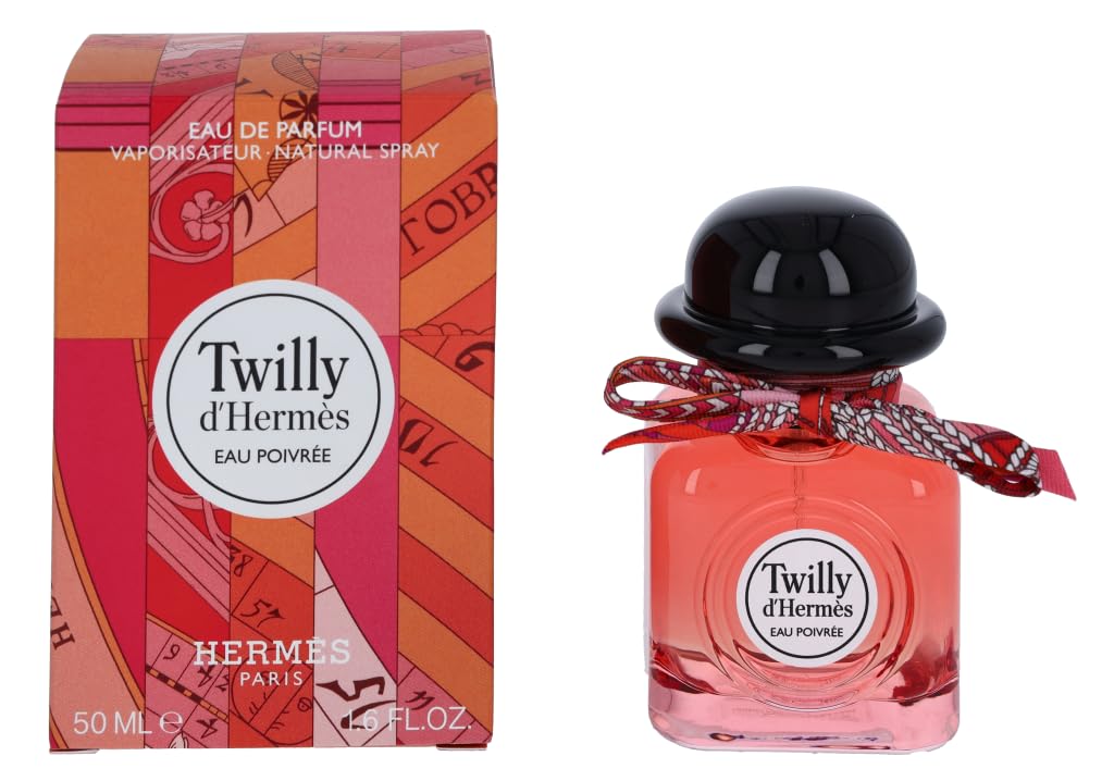 Square coral-tinted 50 ml bottle with hand-tied silk ribbon and spiced floral perfume