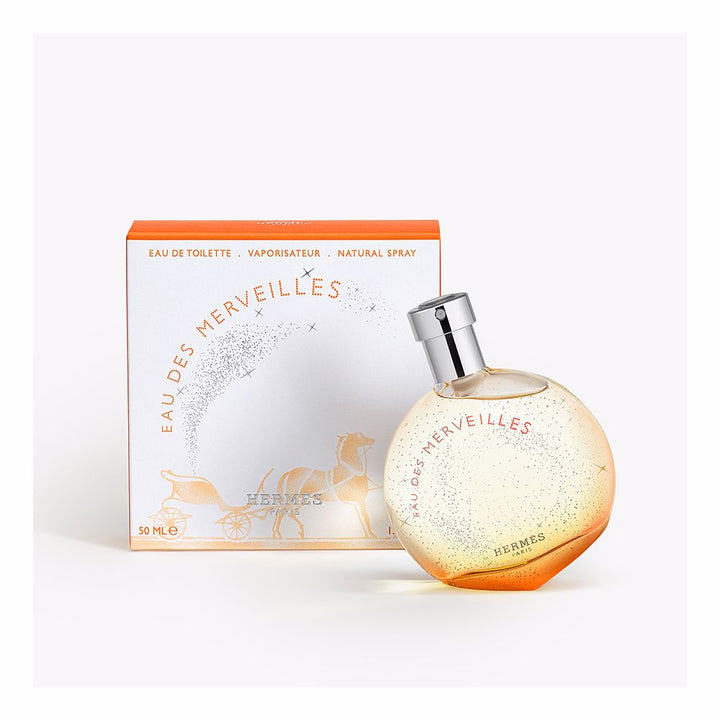 Rounded glass bottle of amber-hued eau de parfum, 50 ml, woody amber notes