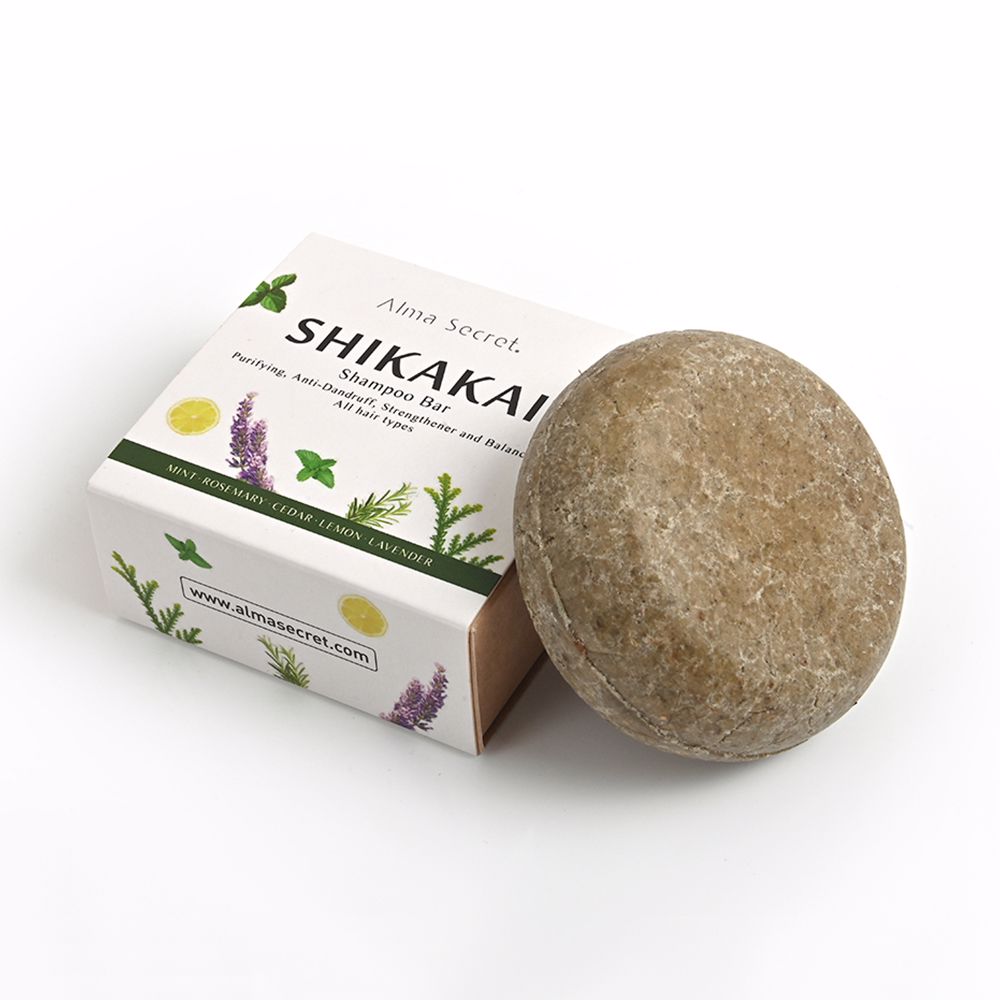 85 g round solid shampoo bar with botanical ingredients, travel-friendly packaging
