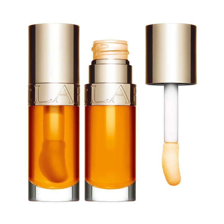 7 ml sheer botanical lip oil in warm honey shade with wand applicator