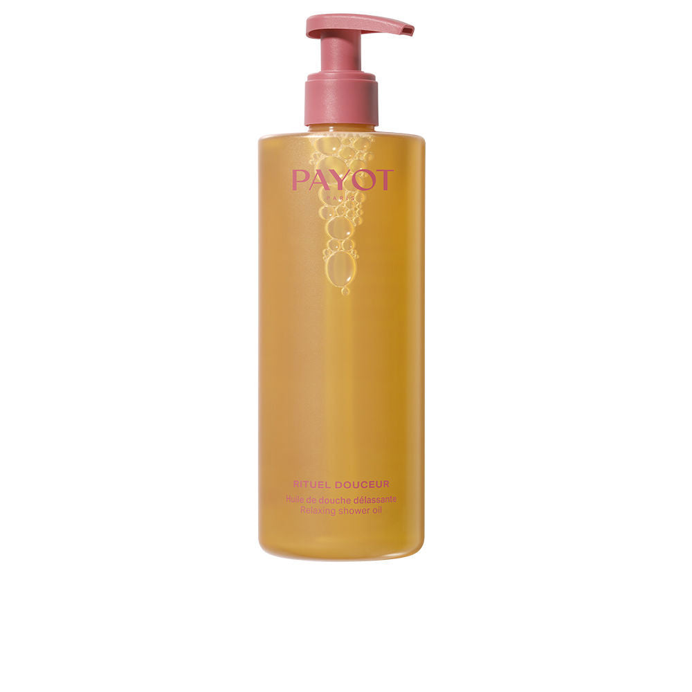 Payot minimalist transparent plastic shower oil bottle, yellow-pink liquid with visible bubbles and pump dispenser