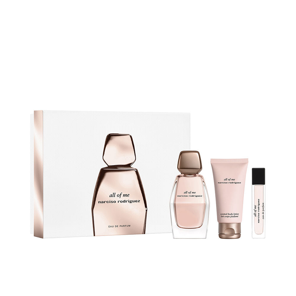 Narciso Rodriguez Perfume gift set with three items: glass bottle with geometric cap, pink tube, small spray bottle in white box