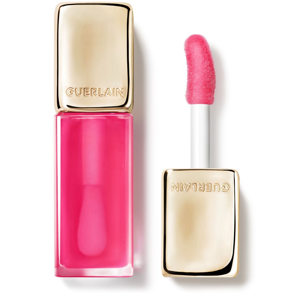 Rectangular glass lip gloss bottle showing pink oil, gold cap with embossed Guerlain name, angled applicator