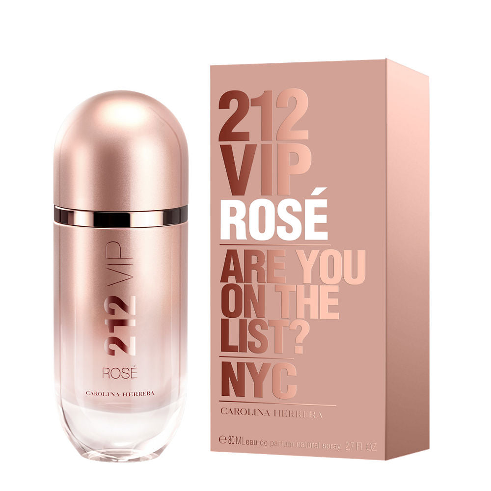 Carolina Herrera Rose-gold glass perfume bottle with metallic finish, rounded cap, transparent base beside cardboard box