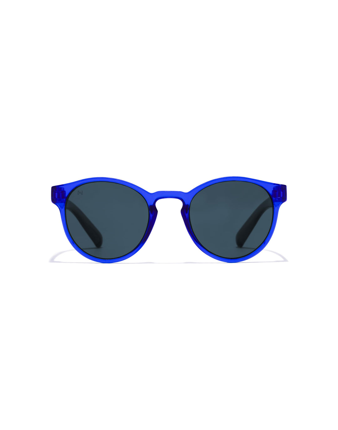 Hawkers round kids sunglasses, transparent blue plastic frame, keyhole bridge, dark round lenses