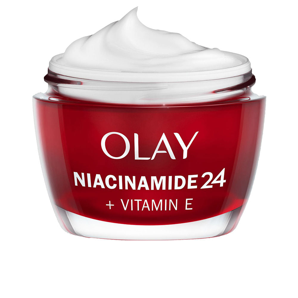 Olay Red and white transparent jar showing cream texture in a plastic or glass jar, photographed close-up.