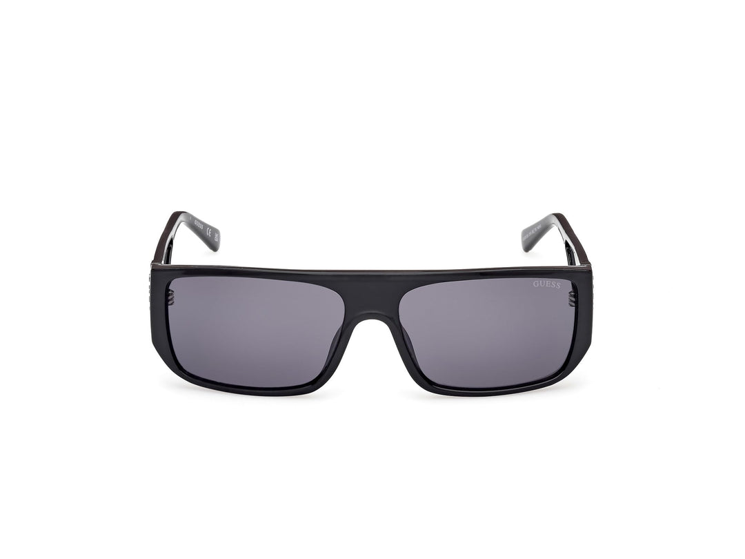 Guess rectangular black plastic sunglasses with thick frame, dark tinted lenses, straight temples, lens logo