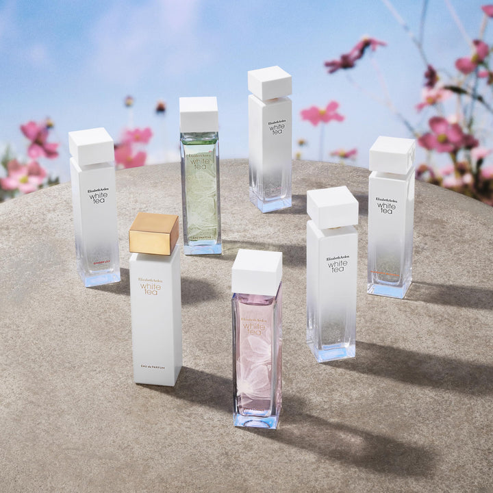 Slim clear bottle with soft pink perfume and gold cap, 100 ml