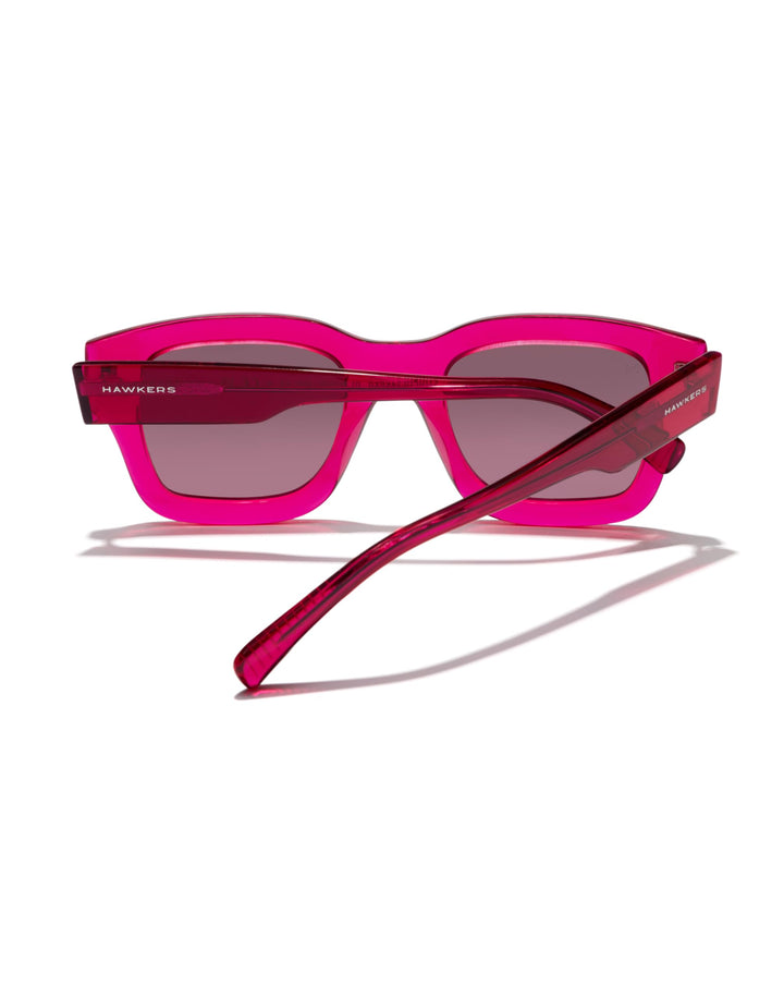 Hawkers Pink transparent plastic square sunglasses with thick frame, rectangular lenses and dark tinted lenses