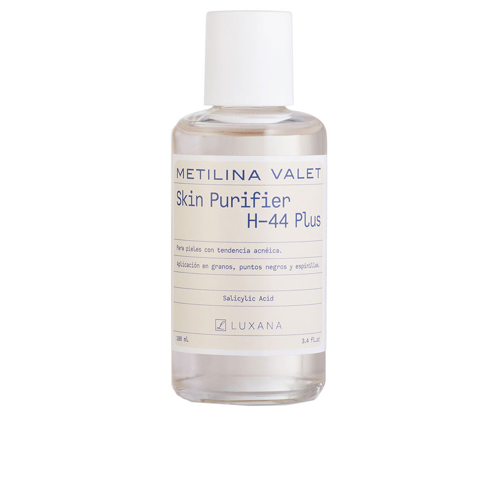 Clear plastic bottle with white screw cap, rectangular label with blue and black text, measurement markings, Metilina Valet
