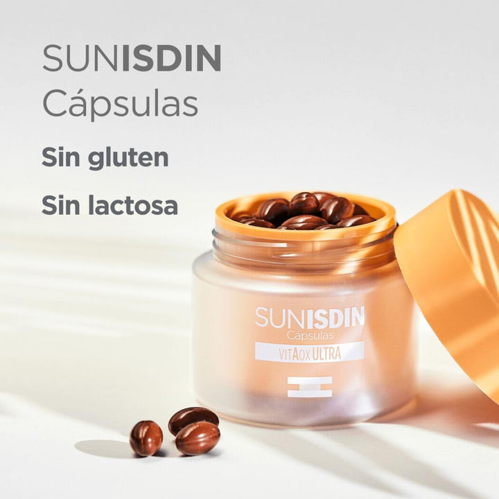 Isdin Two orange‑lidded plastic jars and rectangular box in orange and white, one jar showing capsules, clean minimalistic packaging