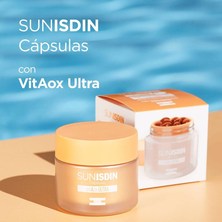 Isdin Two orange‑lidded plastic jars and rectangular box in orange and white, one jar showing capsules, clean minimalistic packaging