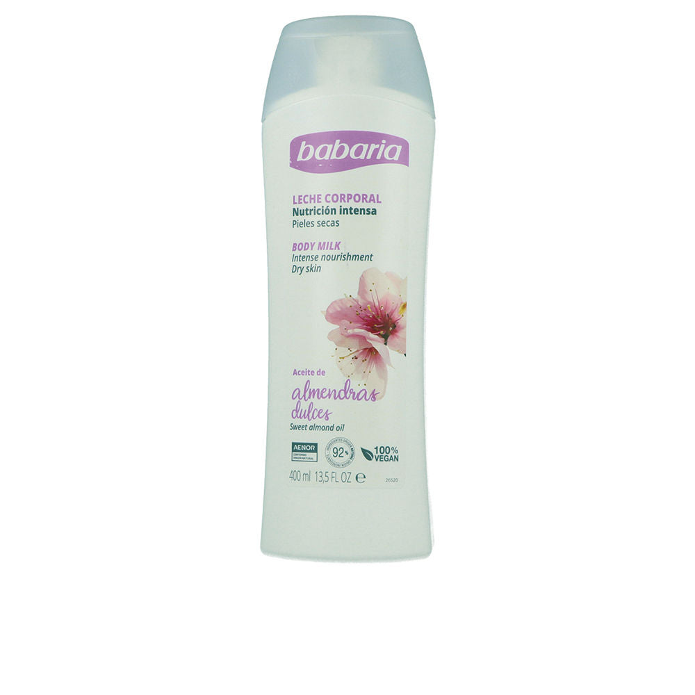 Babaria White plastic body milk bottle with flip-top cap and delicate floral graphic, minimalist styling.
