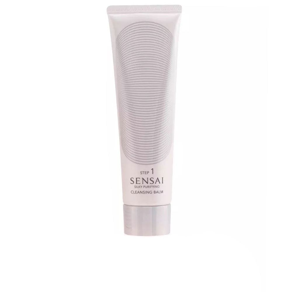 White plastic cleansing balm tube with silver cap and concentric oval line pattern, Sensai.