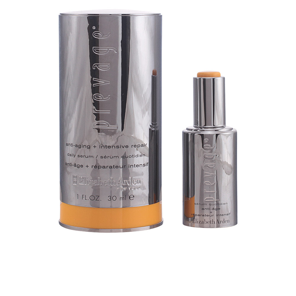 Elizabeth Arden Silver and orange metallic cylindrical serum with embossed text and twist-up stick applicator, polished finish