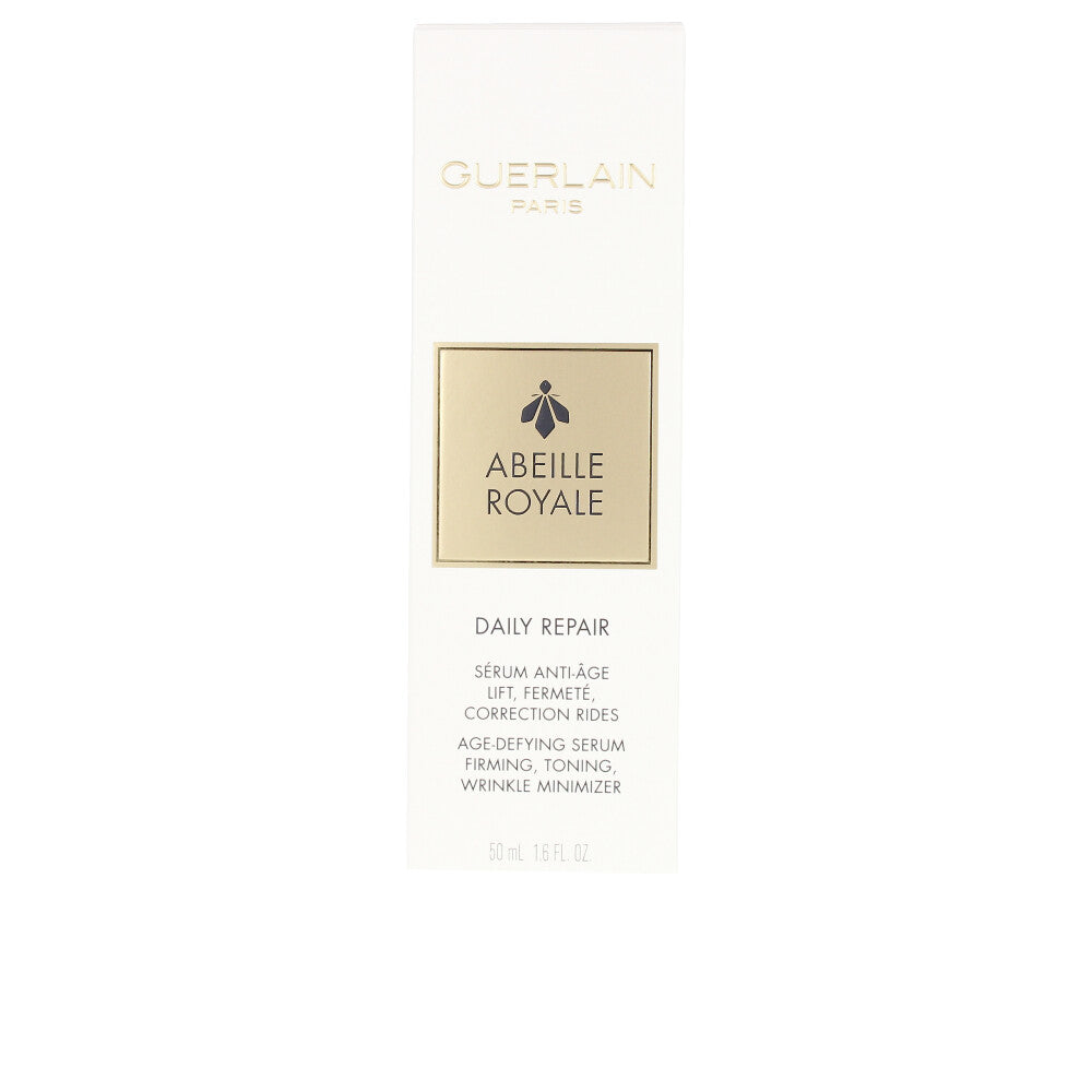 Elegant amber serum bottle with pump, labelled Abeille Royale by Guerlain