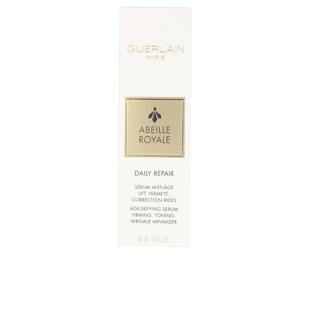 Elegant amber serum bottle with pump, labelled Abeille Royale by Guerlain
