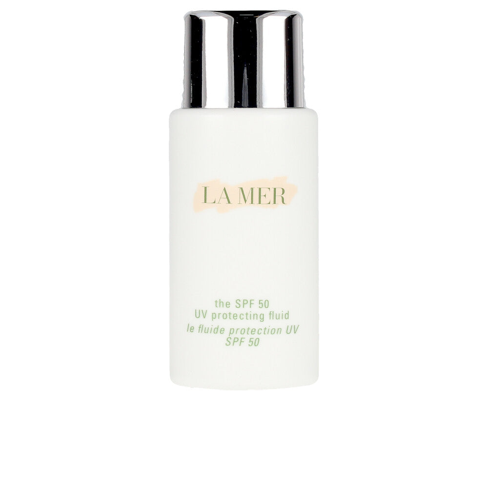 Slim bottle of La Mer SPF50 lightweight fluid sunscreen on neutral background