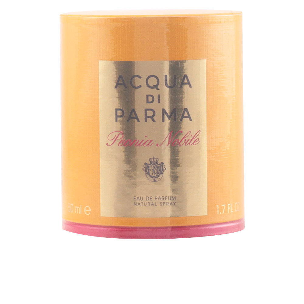 Clear crystal 50 ml perfume bottle with rose-pink liquid and rose-gold cap