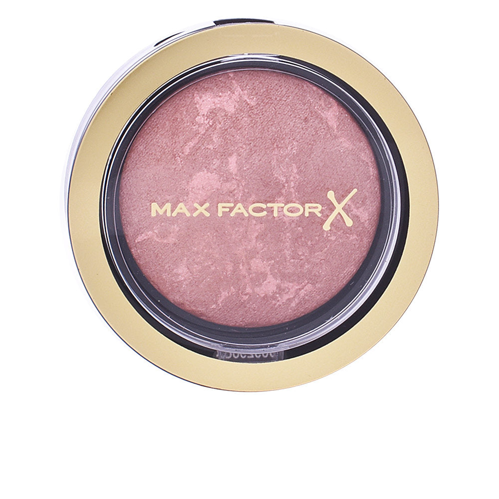 Compact 1.5 g multi‑tone cream blush in satin rose, buildable finish