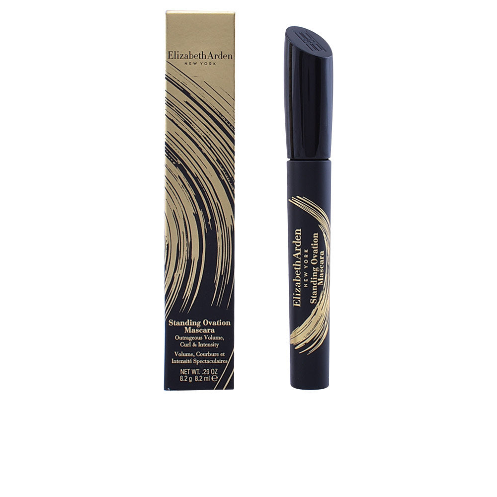 Elizabeth Arden Black and gold cylindrical mascara tube with curved gold brush-stroke design and removable cap