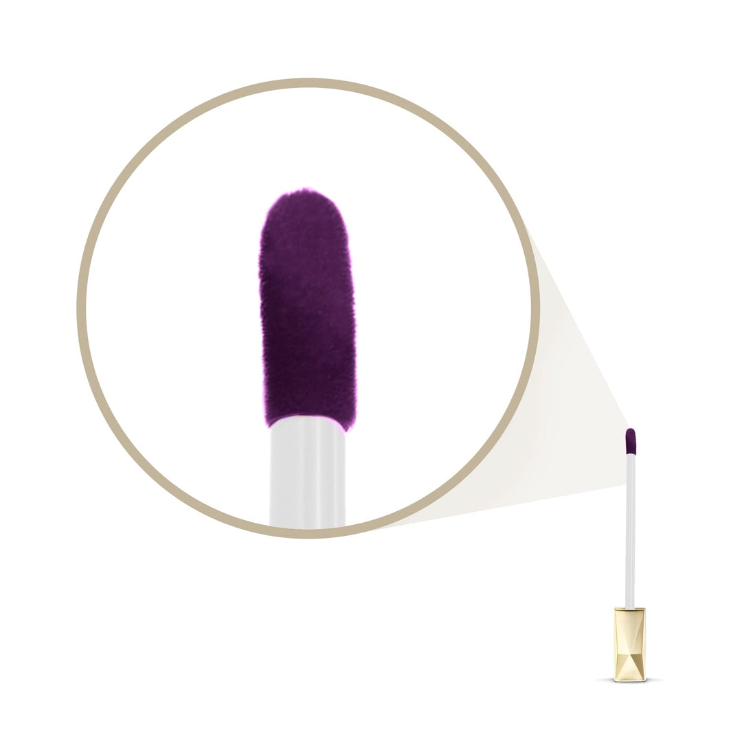 Max Factor Modern plastic lip gloss tube with transparent body, visible purple liquid, geometric gold cap, vertical label