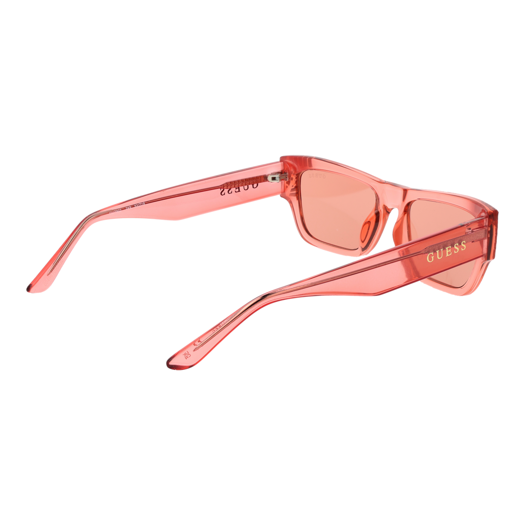 Translucent pink rectangular Guess sunglasses with decorative stones on corners and UV400 lenses on white background