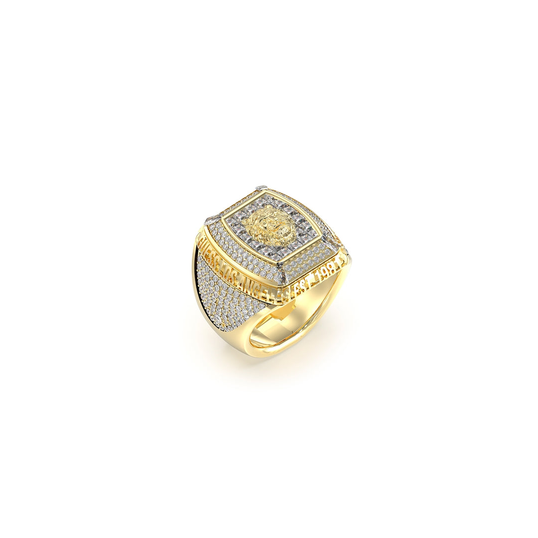 Gold and silver mixed-metal signet ring featuring a detailed lion head, engraved text and small set stones on a Man&