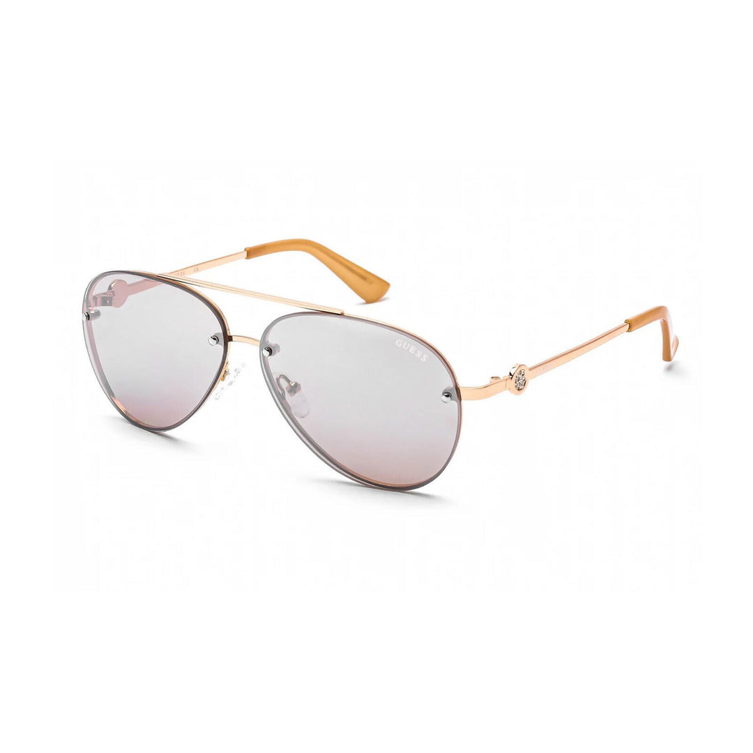 Gold metal aviator sunglasses with gradient pink lenses, black temple tips, and Guess logo visible