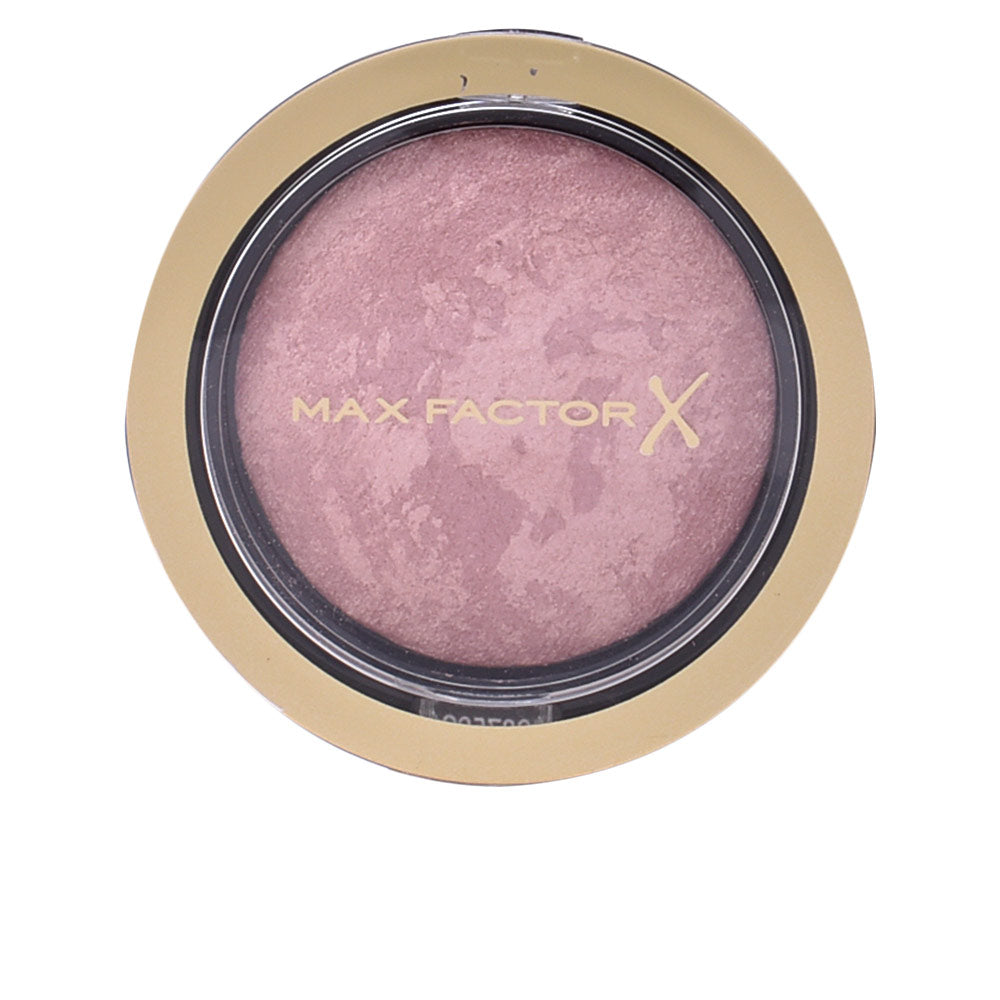Compact 1.5 g multi‑tone cream blush in satin rose, buildable finish